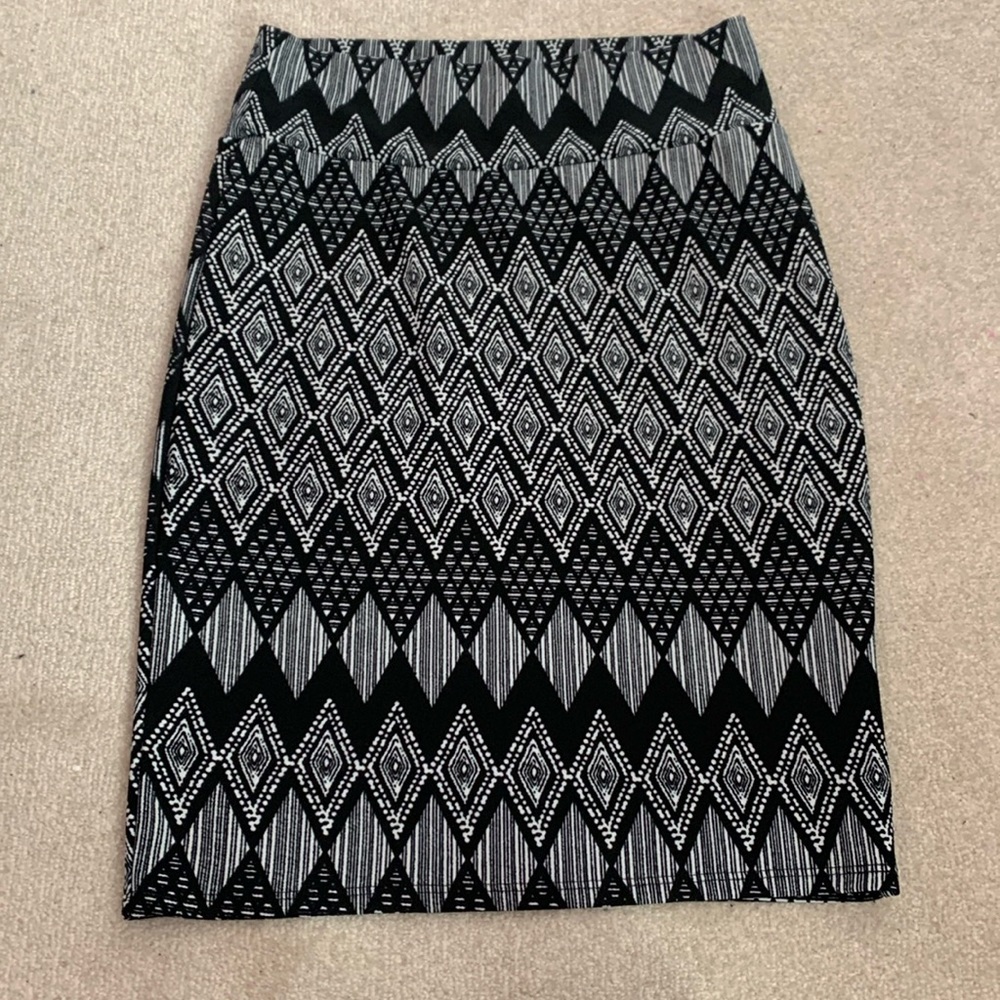 LuLaRoe skirt. Tight fitted. Black and white design. Close to knee length Boho